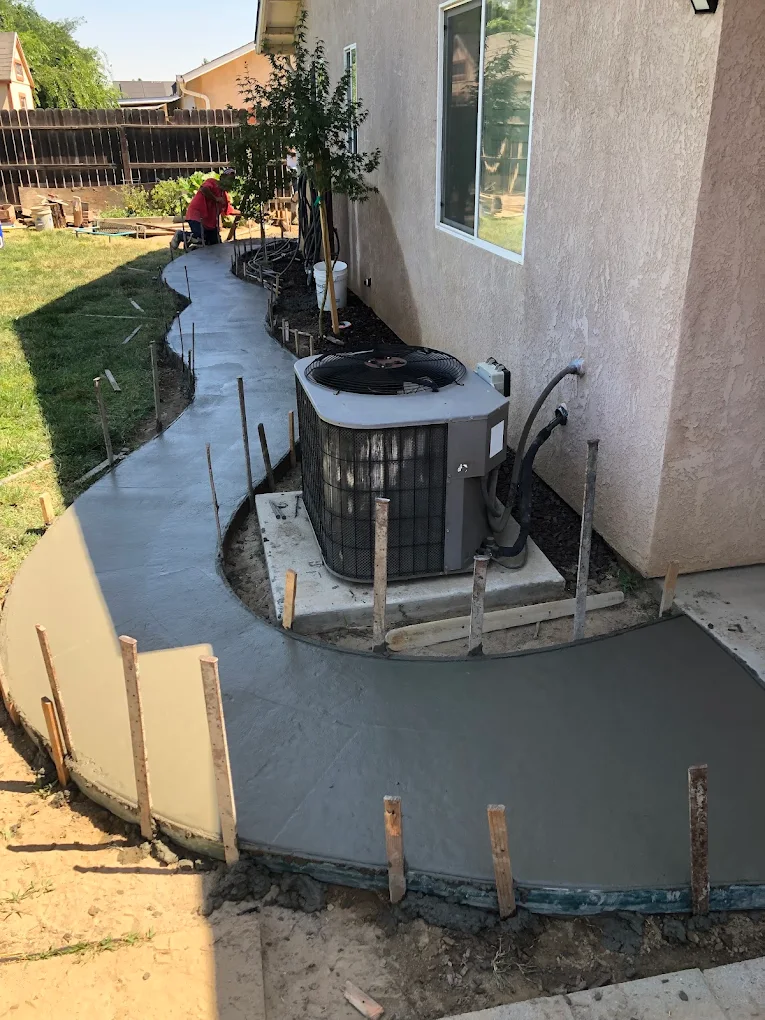 Concrete pad and walkway pour for HVAC unit